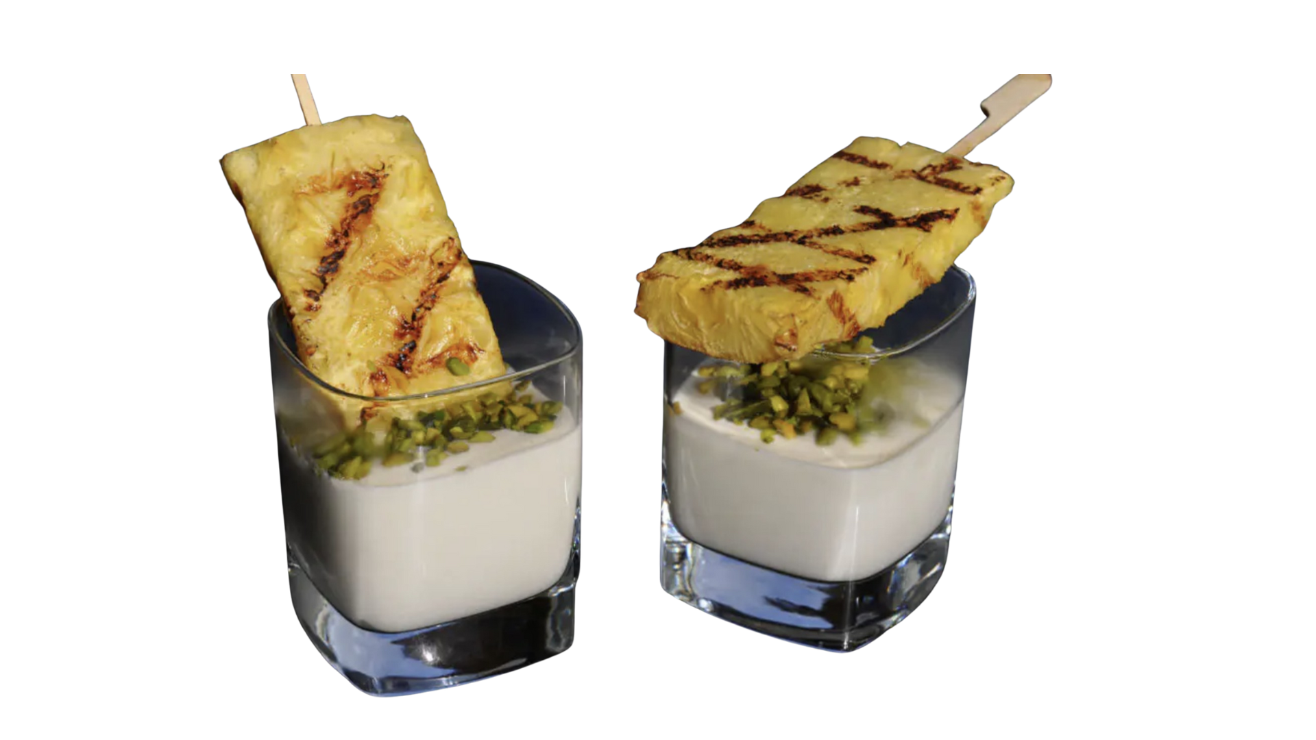 Grilled pineapple a la Santos topped with special dip, a tropical delicacy served by Santos Gourmet.